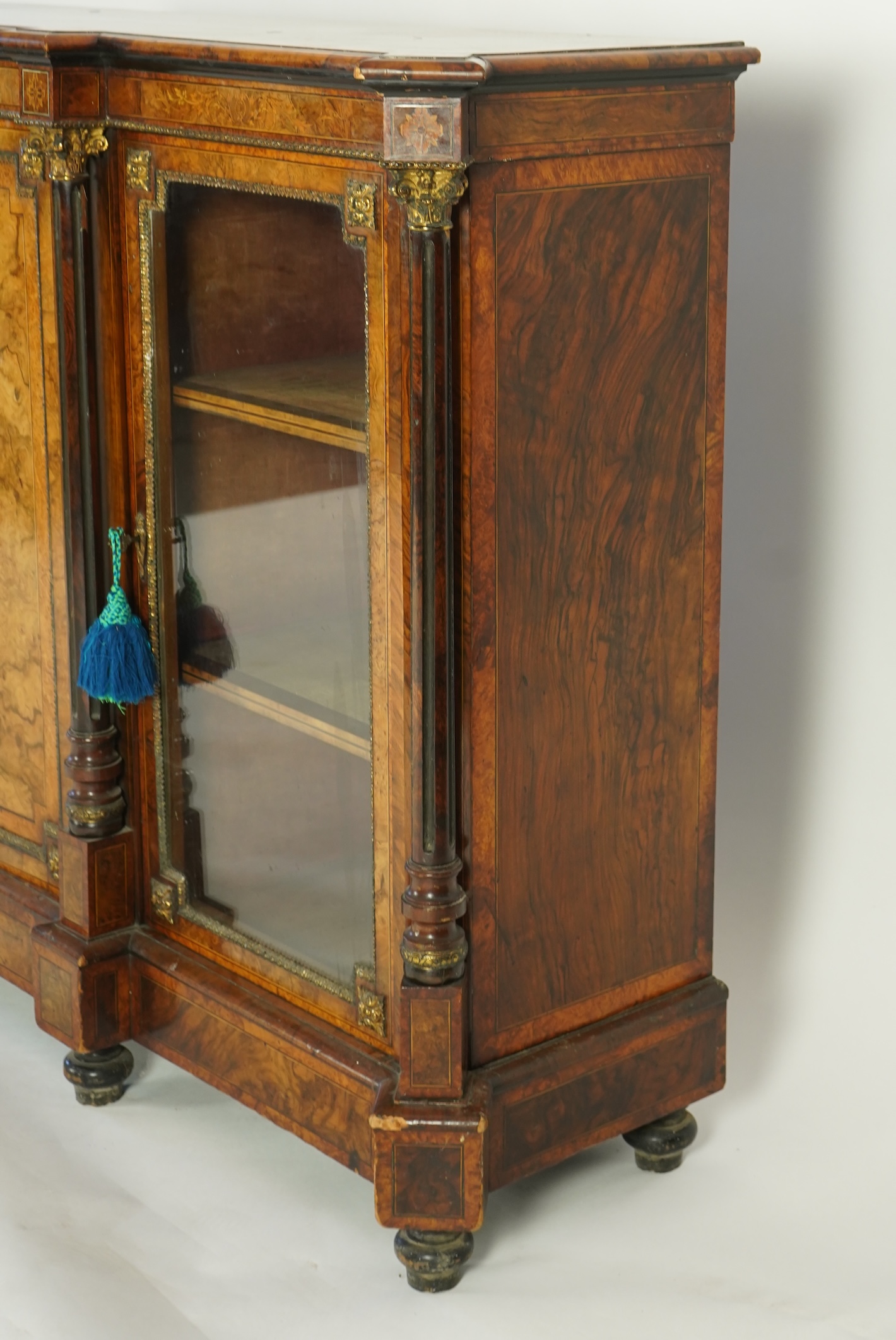 A Victorian birds eye maple banded, gilt metal mounted figured walnut side cabinet